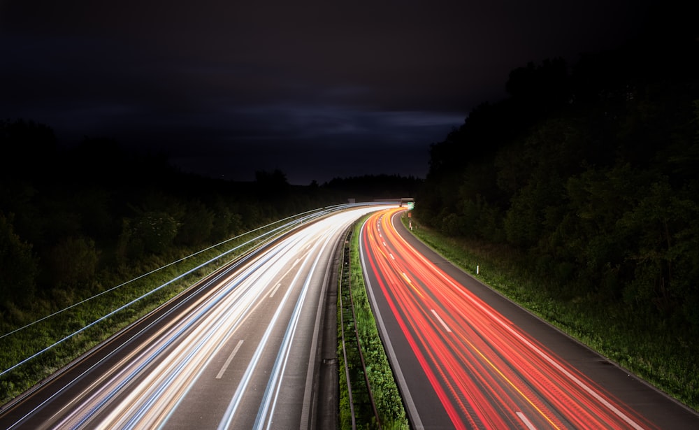 timelapse photography of vehicle tailights in road at night time