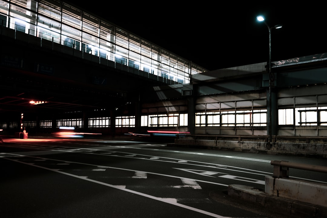 gray concrete roadway at night time