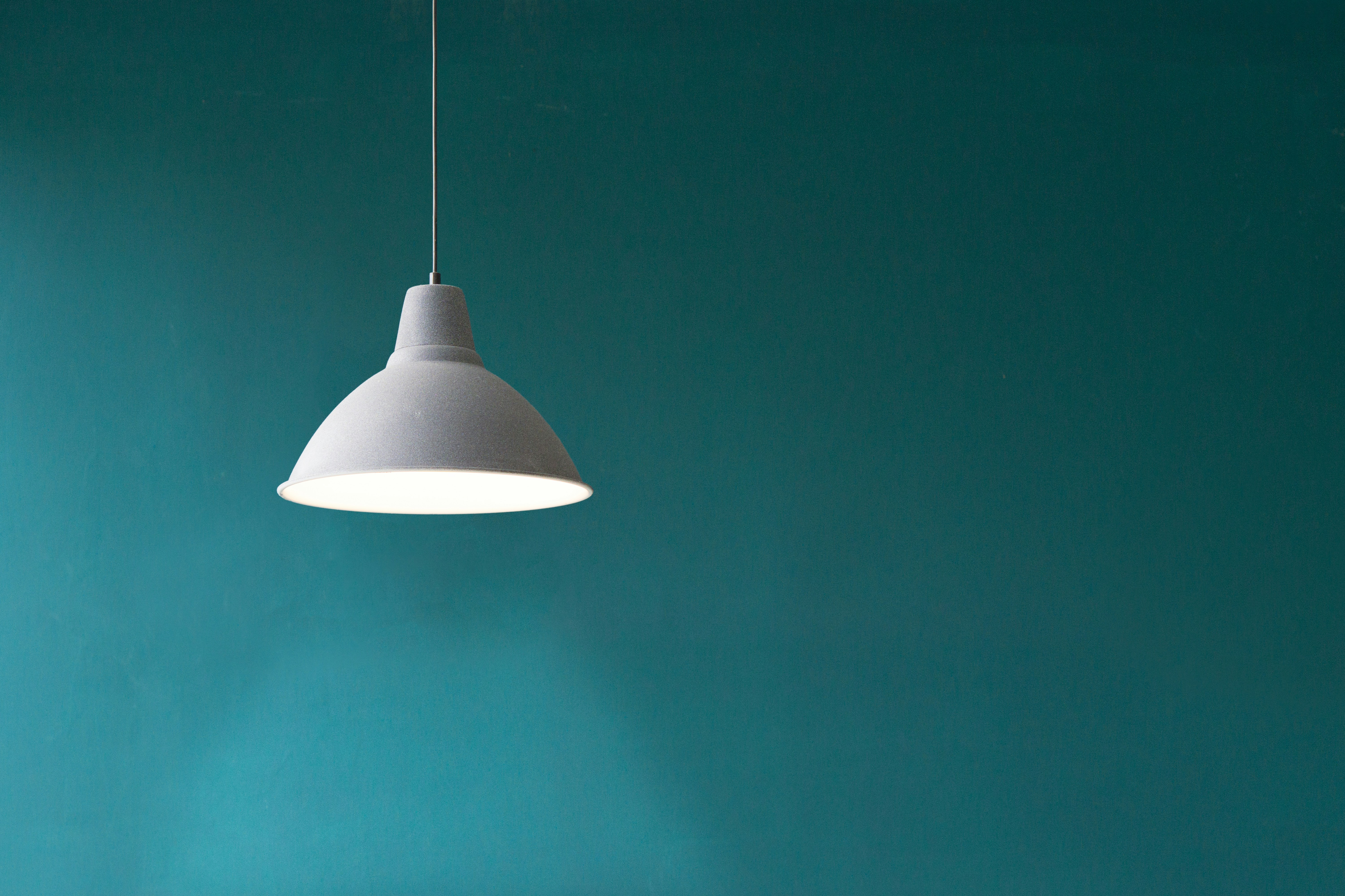 modern pendant light replacing standard rental fixture - how to transform a rental apartment