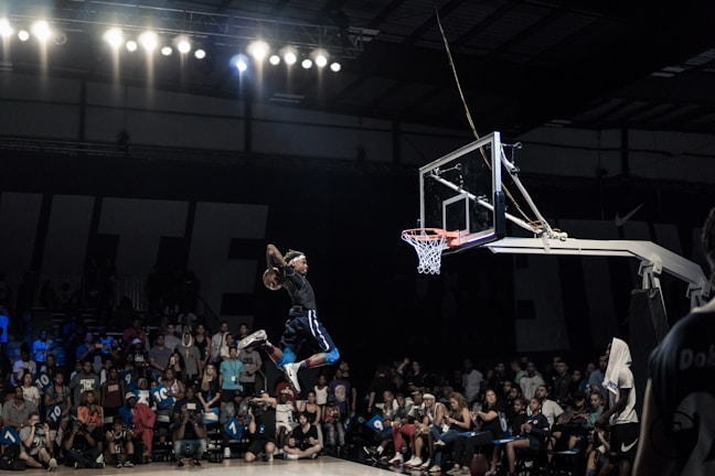 A basketball player making a slam dunk.