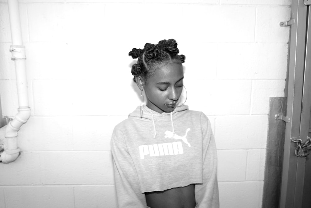 grayscale photography of woman wearing crop top sweatshirt