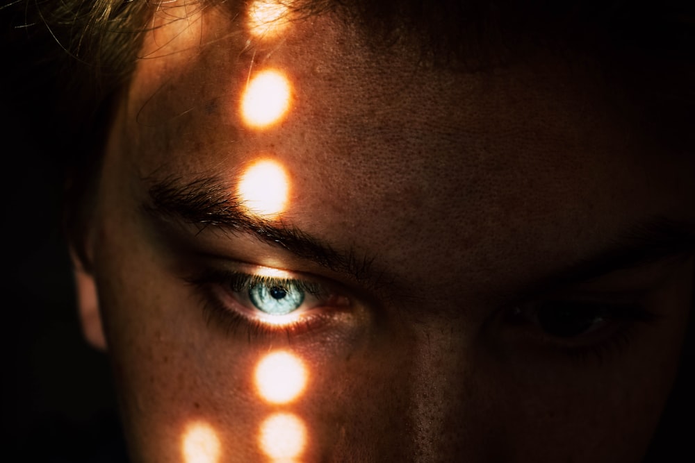 close-up photo of blue human eye