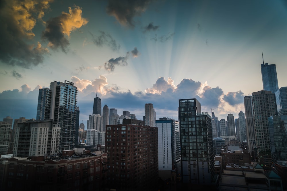 high-rise and mid-rise buildings under cloudy sky