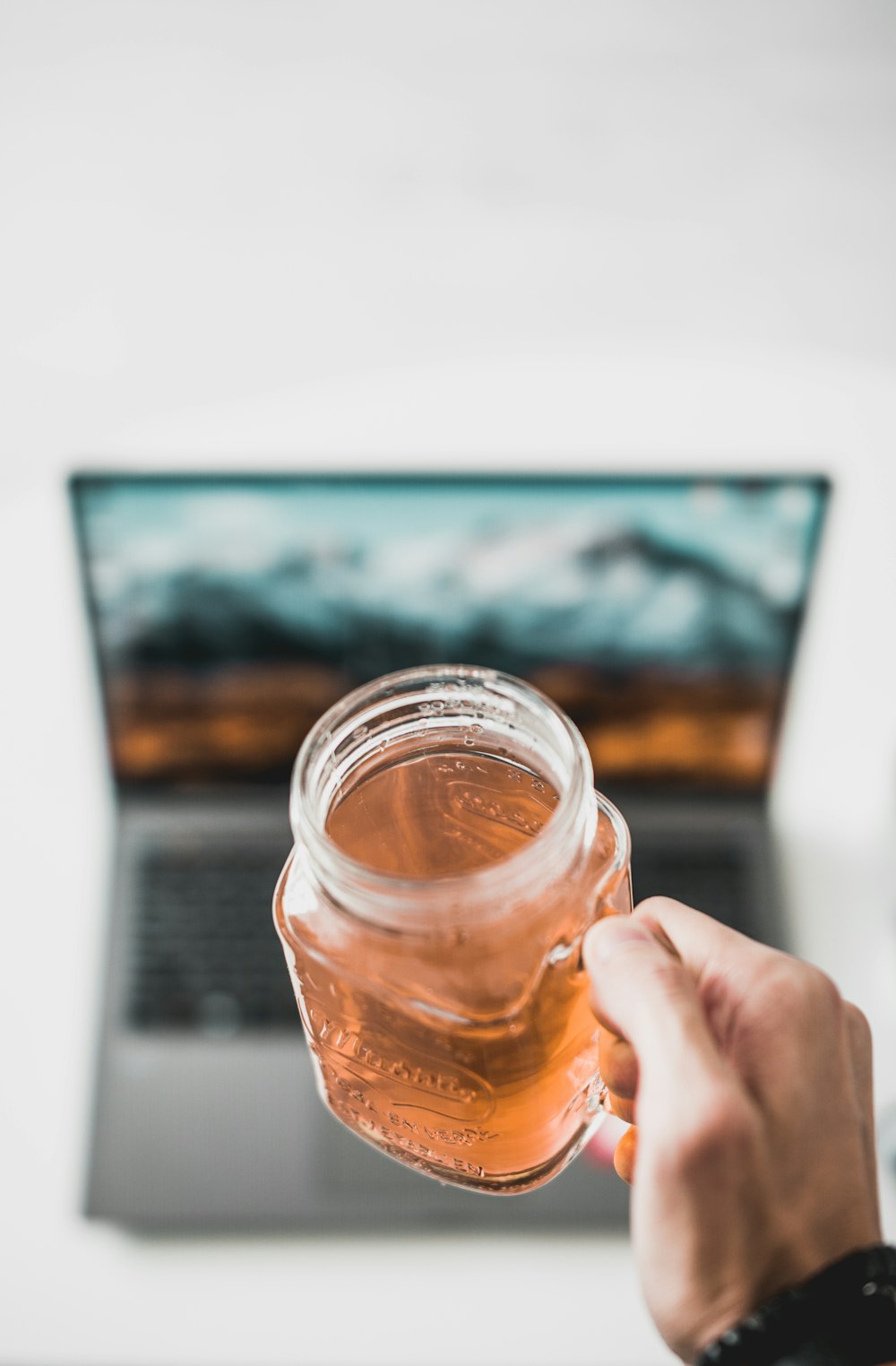 selective focus photo of oa clear glass mug