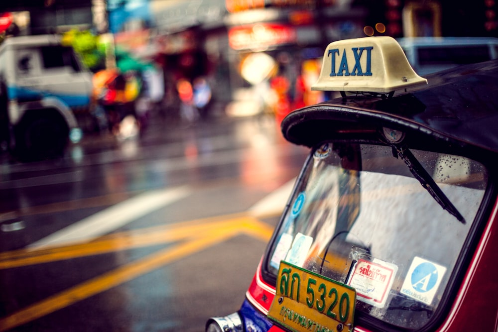 red Taxi vehicle