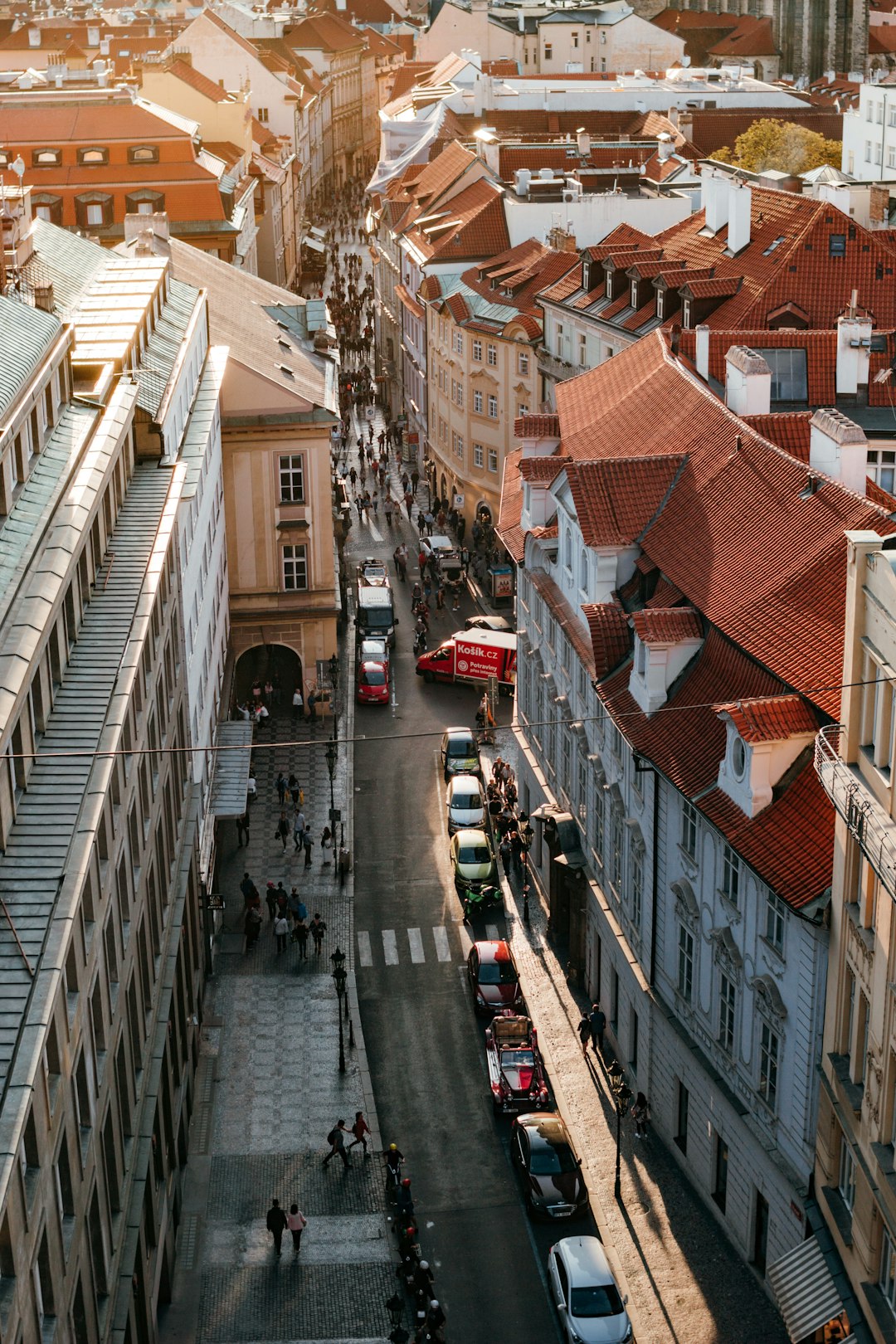 cars parked beside road and building