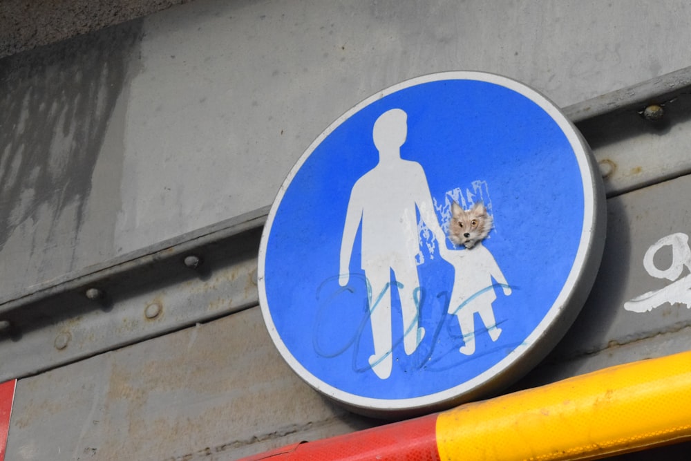 round blue person holding child sigh