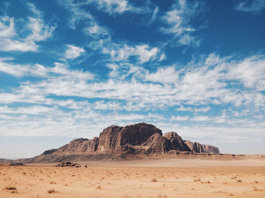 landscape photography of mountains and sky, Our second day in the desert. Peaceful clouds accompanied us on our walk thr