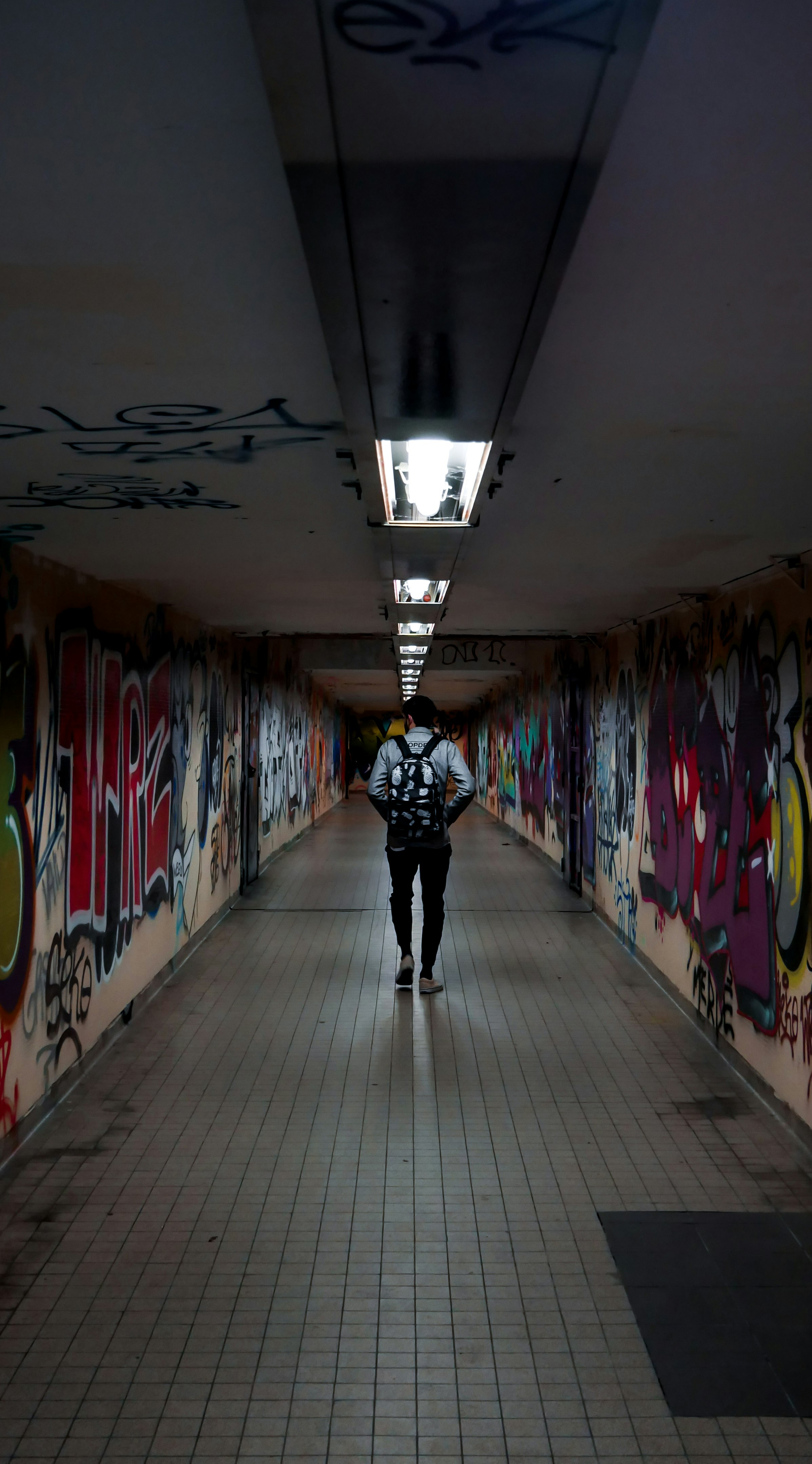 man walking in hallway