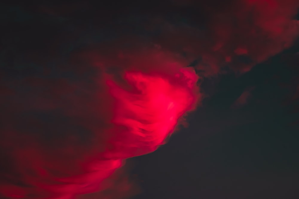 a red cloud is in the sky at night