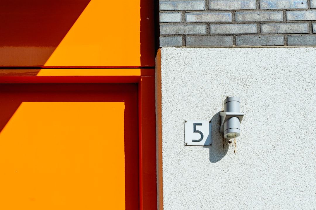 5 signage on white wall