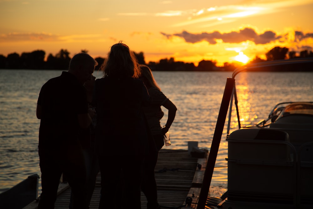 silhouette photo of three persons