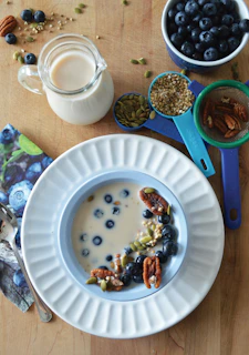 Close-up of fresh blueberries and walnuts on a wooden table, symbolizing brain-boosting foods.