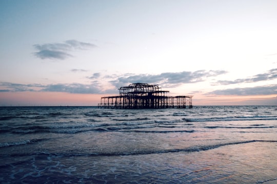 brown metal structure in the middle of sea in West Pier United Kingdom