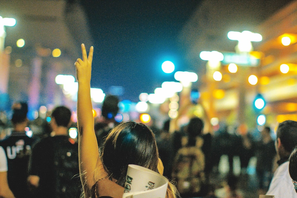 woman raising his hand