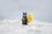 LEGO Batman figurine on white sand at daytime