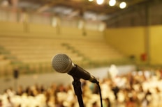shallow focus photo of black corded microphone