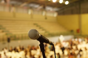 shallow focus photo of black corded microphone