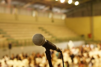 shallow focus photo of black corded microphone