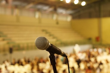 shallow focus photo of black corded microphone