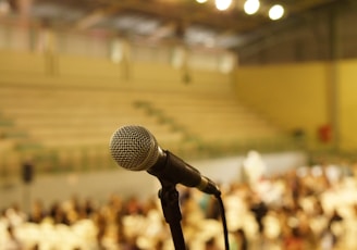shallow focus photo of black corded microphone