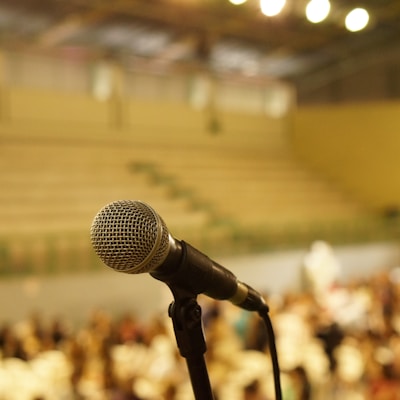 shallow focus photo of black corded microphone