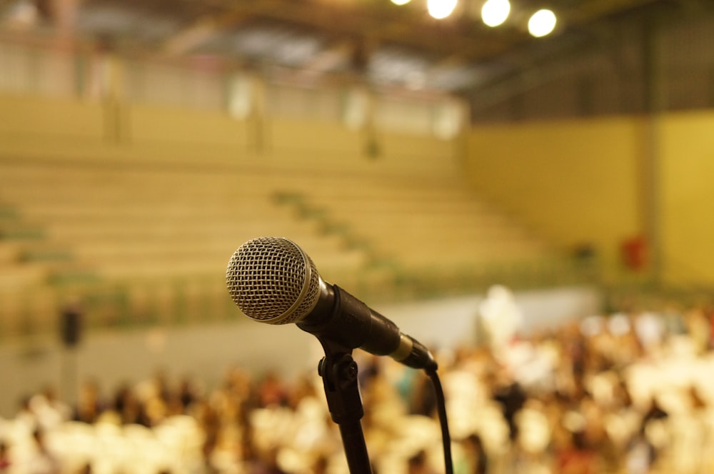 shallow focus photo of black corded microphone