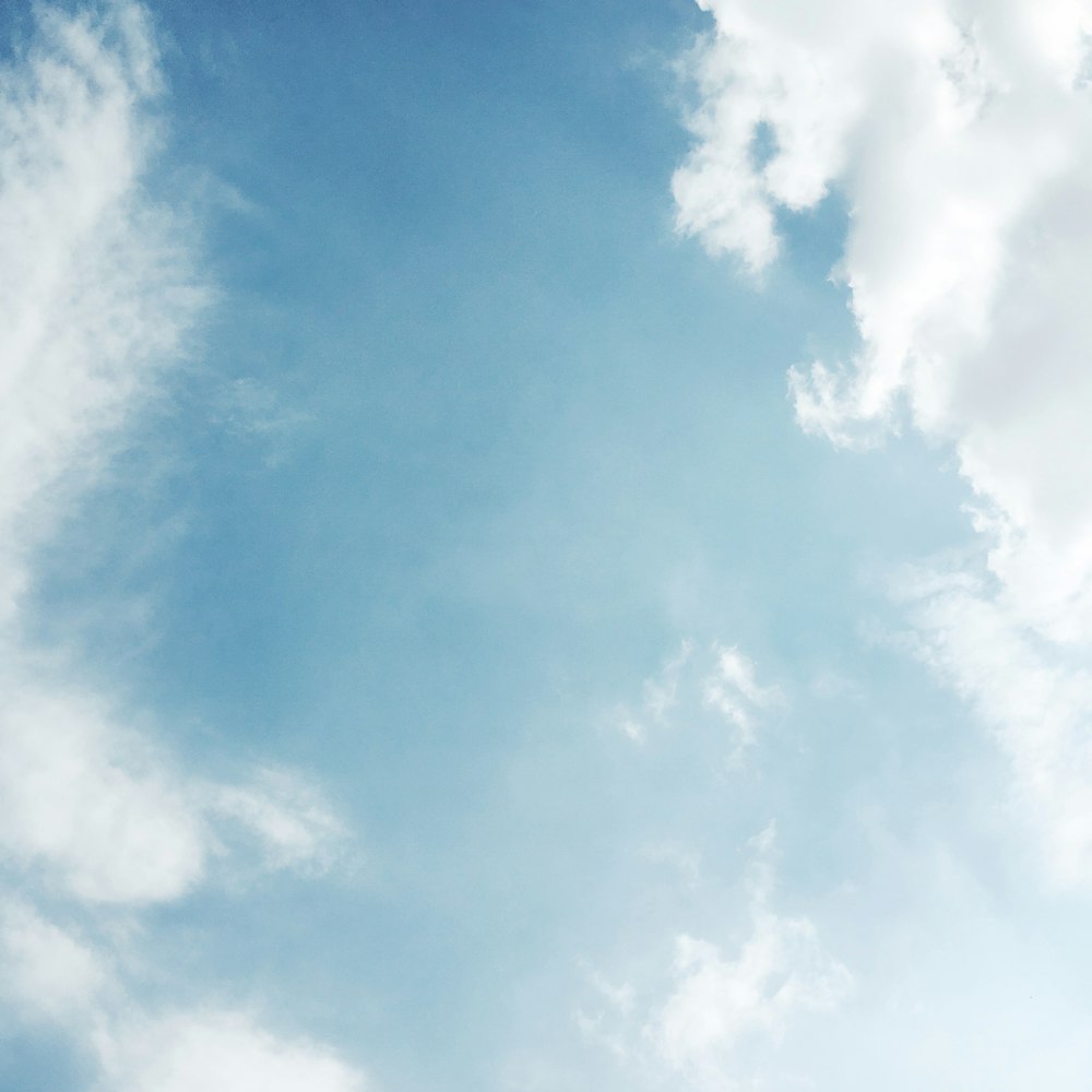 white clouds and blue sky photography photo – Free Blue Image on Unsplash