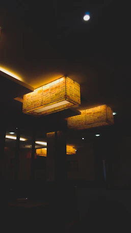 Cozy, softly lit intimate venue space with elegant decor and warm ambiance.