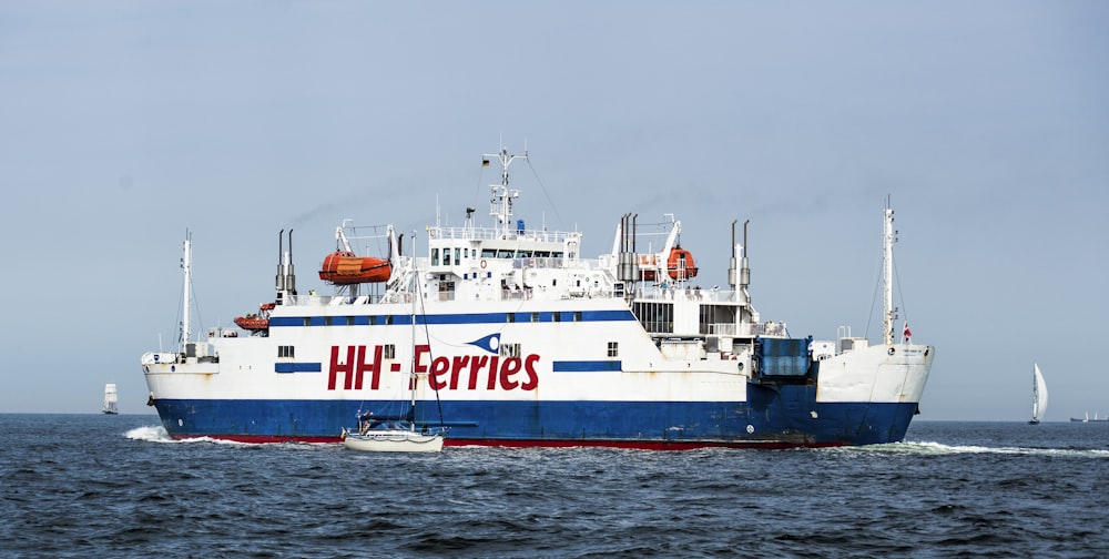 white and blue HH-Ferries vessel on harbor