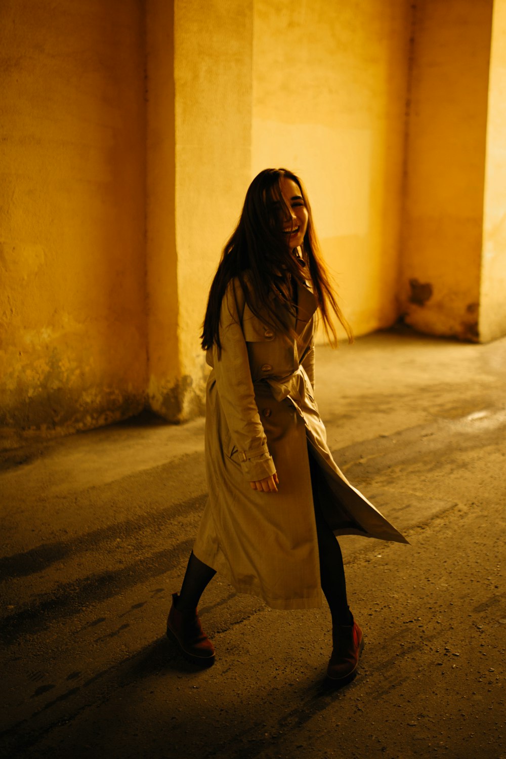 woman in brown coat standing