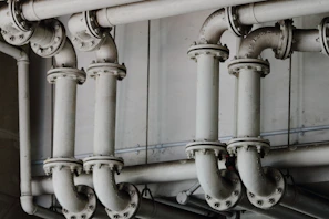 Visual of piping installations with joined pipes in an industrial environment.