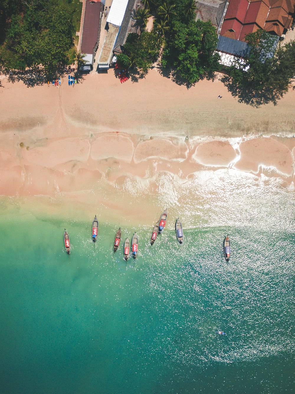 aerial photography of boat near beach