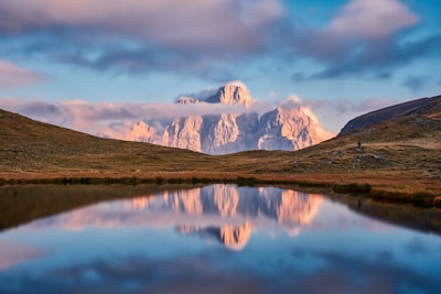 overlooking view of mountain under clouds baste teams background