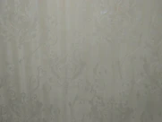 Textured wallpaper with subtle metallic accents enhancing a stylish office space