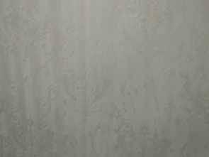 Close-up of a vibrant geometric patterned wallpaper enhancing a modern room