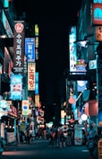 buildings with pathway surround by people