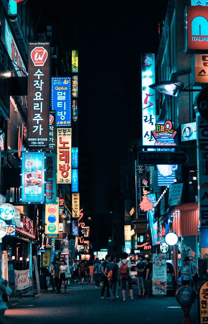 A neon-lit street in Seoul at night