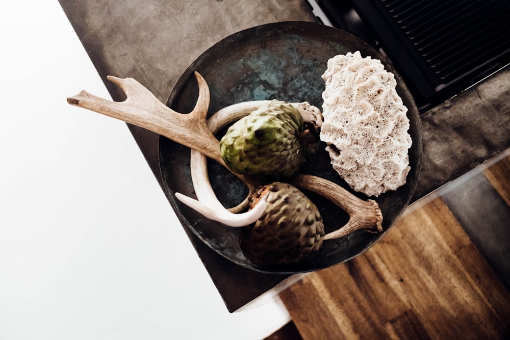 pair of brown deer antlers on pot