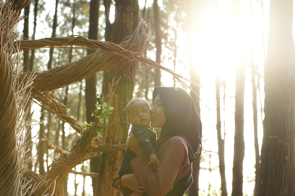 woman carrying baby