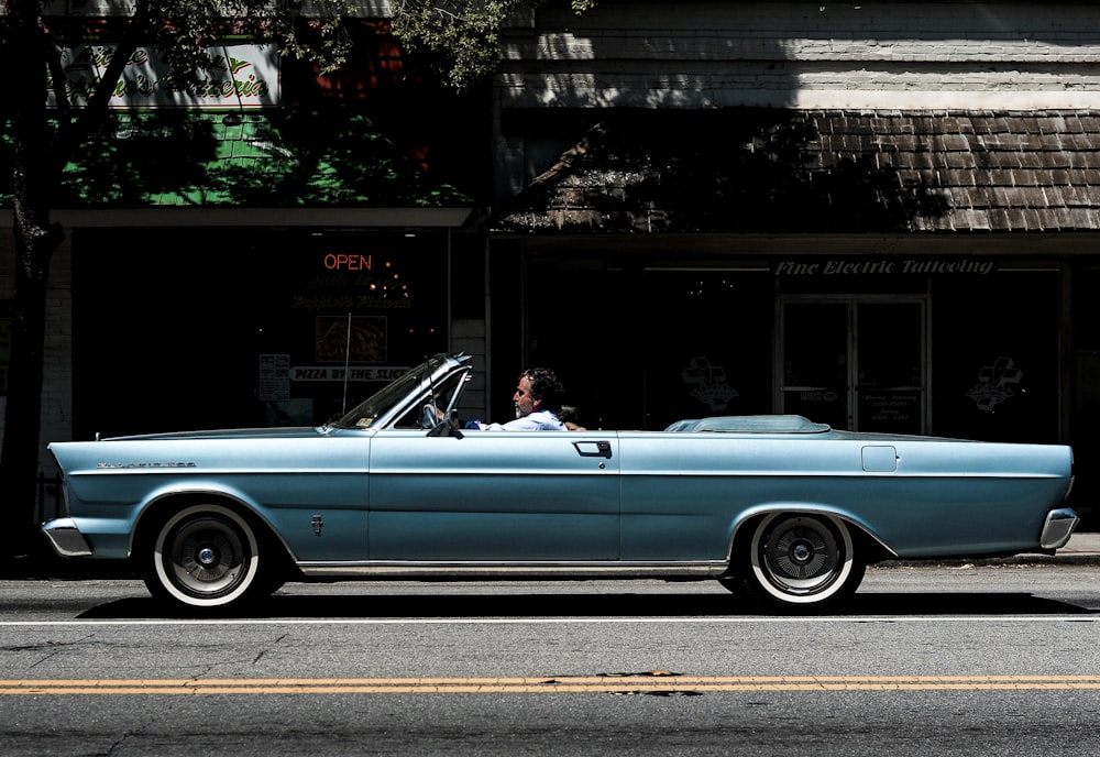 man riding on convertible