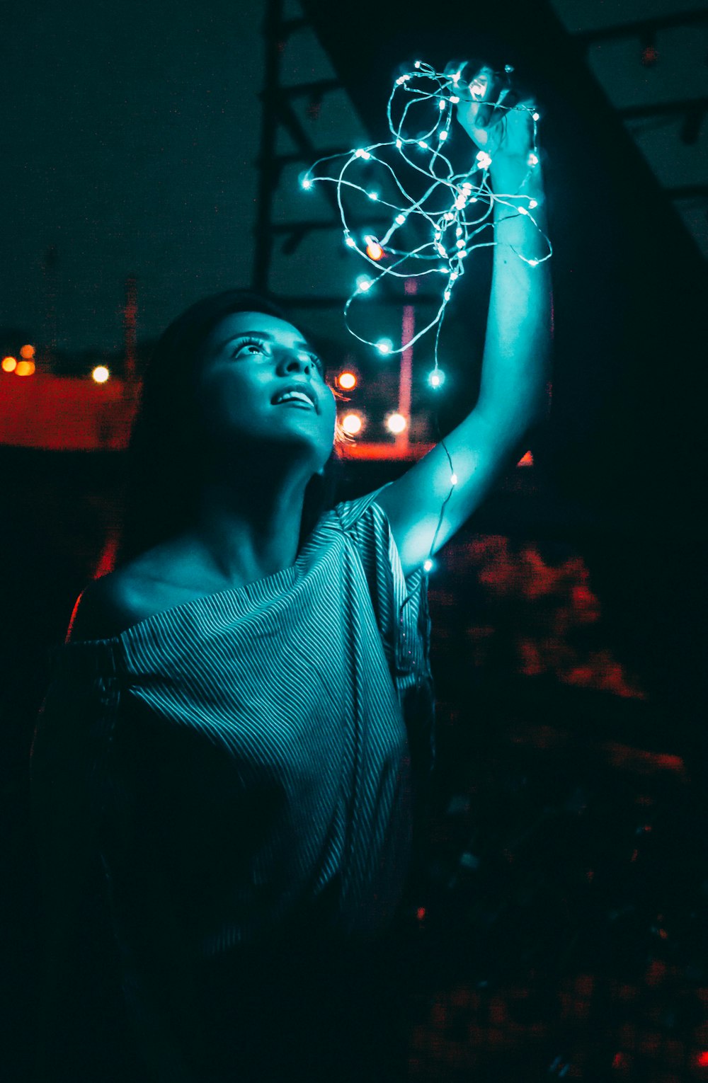 woman holding white string light