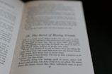An open book displaying text on its pages. The text appears to discuss themes related to making friends, with phrases suggesting insights on the topic. The visible page is marked with a large chapter or section number and a title.