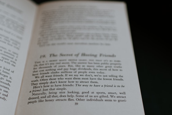 An open book displaying text on its pages. The text appears to discuss themes related to making friends, with phrases suggesting insights on the topic. The visible page is marked with a large chapter or section number and a title.