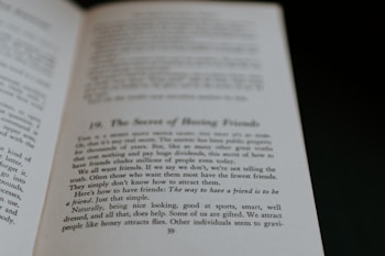 An open book displaying text on its pages. The text appears to discuss themes related to making friends, with phrases suggesting insights on the topic. The visible page is marked with a large chapter or section number and a title.