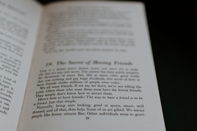 An open book displaying text on its pages. The text appears to discuss themes related to making friends, with phrases suggesting insights on the topic. The visible page is marked with a large chapter or section number and a title.