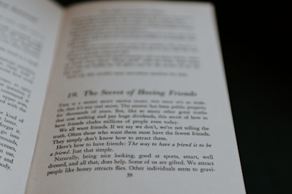 An open book displaying text on its pages. The text appears to discuss themes related to making friends, with phrases suggesting insights on the topic. The visible page is marked with a large chapter or section number and a title.