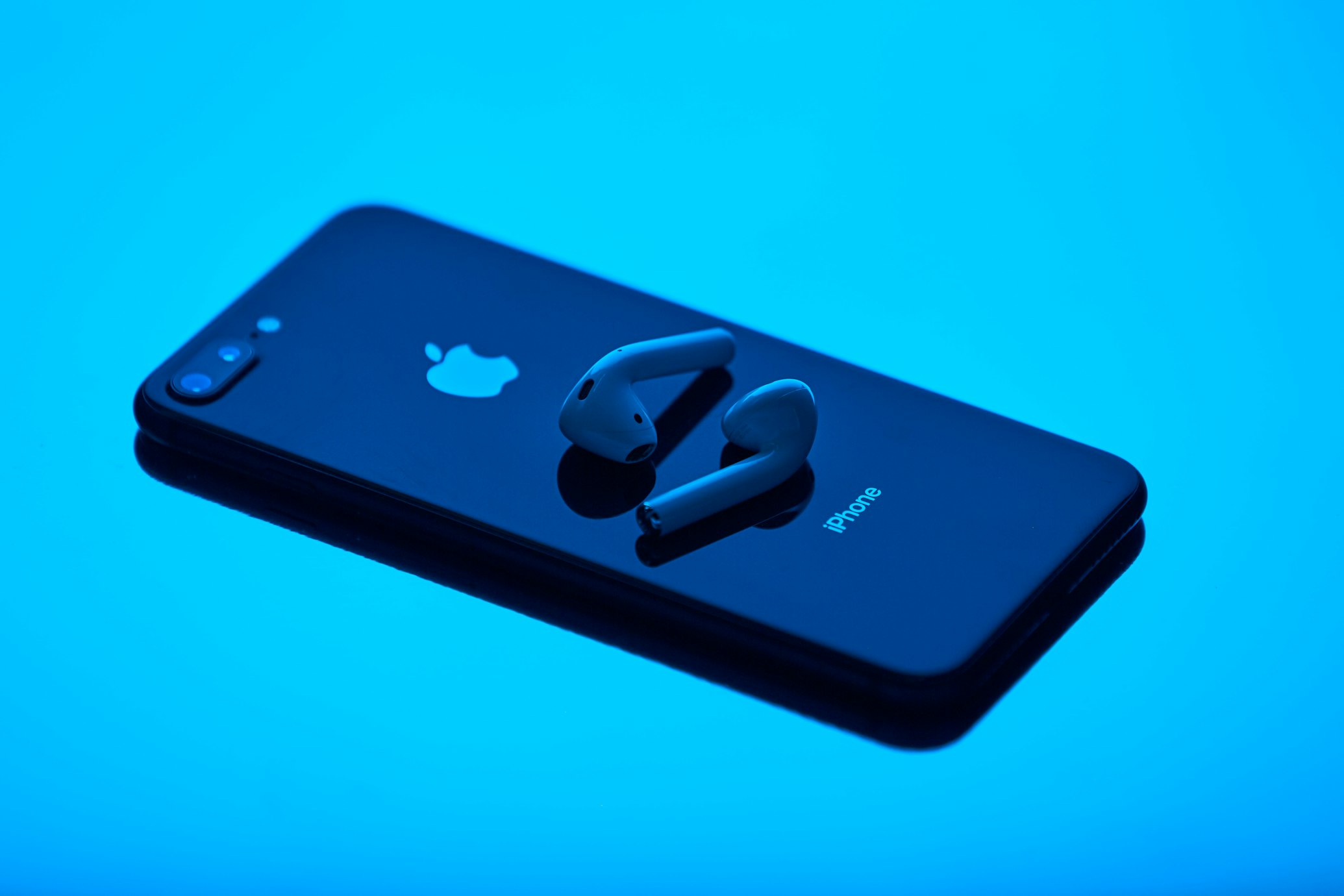 Smartphone and earbuds during Bluetooth pairing process