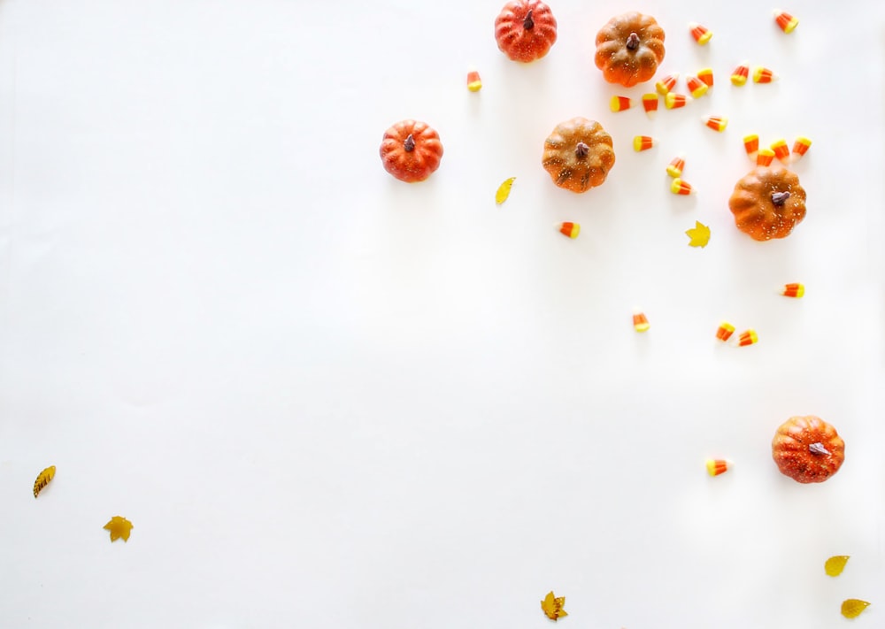 pumpkins on white surface
