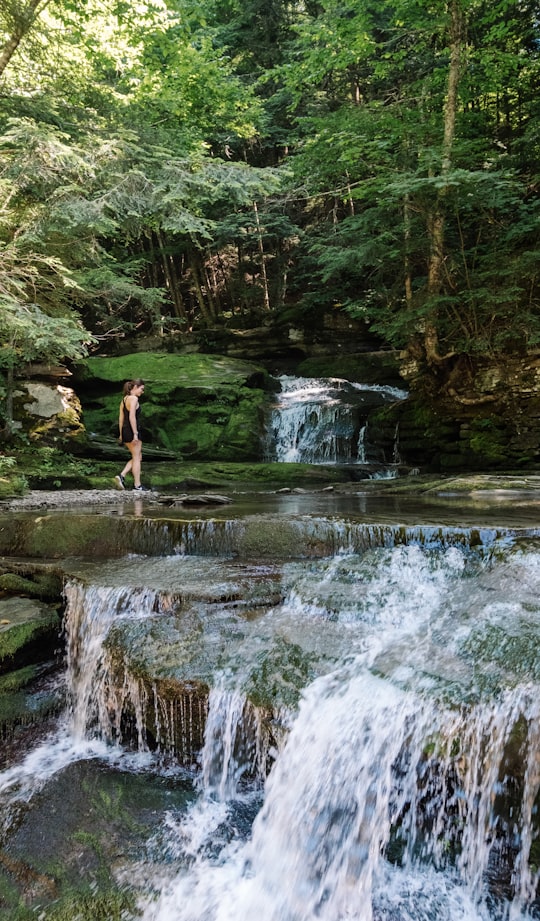 woman standing near body of water in Catskill United States